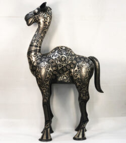 Handmade Moroccan Damascene camel sculpture featuring intricate silver inlay, handcrafted by master artisans in Meknes. Luxury artisan home décor and collectible metal artwork.