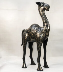 Handmade Moroccan Damascene camel sculpture featuring intricate silver inlay, handcrafted by master artisans in Meknes. Luxury artisan home décor and collectible metal artwork.