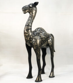 Handmade Moroccan Damascene camel sculpture featuring intricate silver inlay, handcrafted by master artisans in Meknes. Luxury artisan home décor and collectible metal artwork.