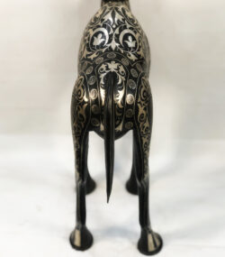 Handmade Moroccan Damascene camel sculpture featuring intricate silver inlay, handcrafted by master artisans in Meknes. Luxury artisan home décor and collectible metal artwork.