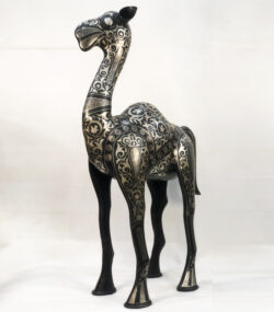 Handmade Moroccan Damascene camel sculpture featuring intricate silver inlay, handcrafted by master artisans in Meknes. Luxury artisan home décor and collectible metal artwork.
