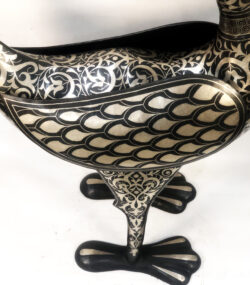 Handmade Moroccan Damascene crane sculpture featuring intricate silver inlay, crafted by master artisans in Meknes. Luxury artisan home décor and collectible metal bird artwork.