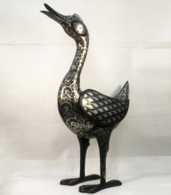 Handmade Moroccan Damascene crane sculpture featuring intricate silver inlay, crafted by master artisans in Meknes. Luxury artisan home décor and collectible metal bird artwork.