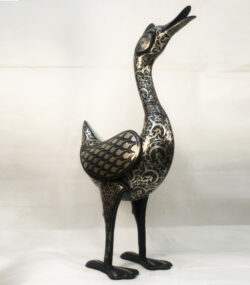 Handmade Moroccan Damascene crane sculpture featuring intricate silver inlay, crafted by master artisans in Meknes. Luxury artisan home décor and collectible metal bird artwork.