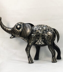 andmade Moroccan Damascene elephant sculpture featuring intricate silver inlay, handcrafted by master artisans in Meknes using traditional Damascene techniques.