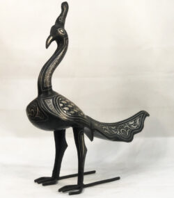Handmade Moroccan Damascene peacock sculpture featuring traditional silver inlay, handcrafted by master artisans in Meknes. Luxury artisan bird decor