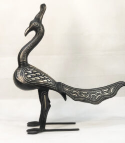Handmade Moroccan Damascene peacock sculpture featuring traditional silver inlay, handcrafted by master artisans in Meknes. Luxury artisan bird decor