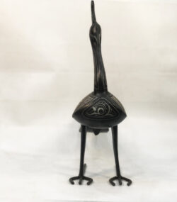 Handmade Moroccan Damascene peacock sculpture featuring traditional silver inlay, handcrafted by master artisans in Meknes. Luxury artisan bird decor
