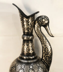 Handmade Moroccan swan pitcher featuring intricate silver hand engravings on black metal, artisan decorative vase for luxury home decor